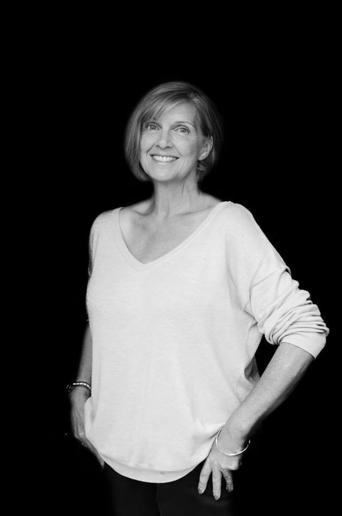 Black and white portrait of Dawn Houghton smiling